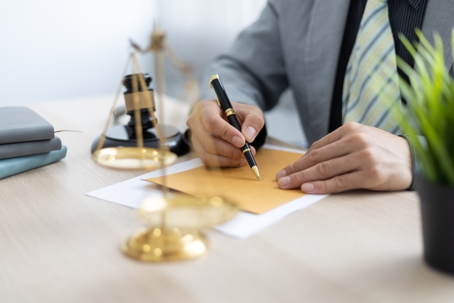 Justice Symbol and Lawyer Checking Documents