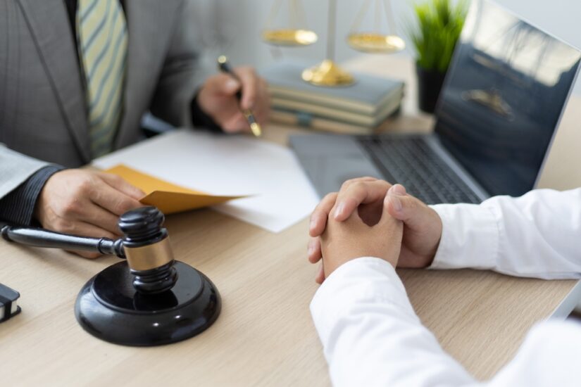 Lawyer Discussing with Client Photo of a Lawyer Discussing with Client