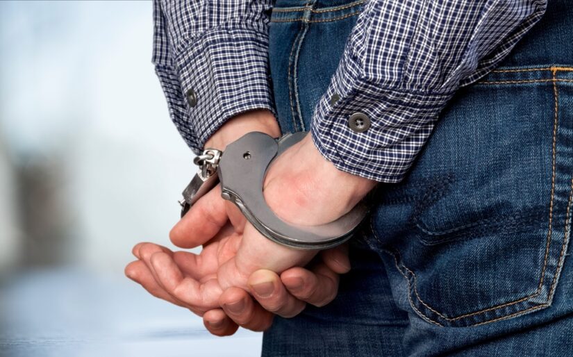 Man in Handcuffs Scene Photo of a Man in Handcuffs Scene